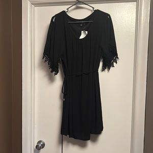 Size L belted black dress. Short sleeved with split sleeves and crochet detail